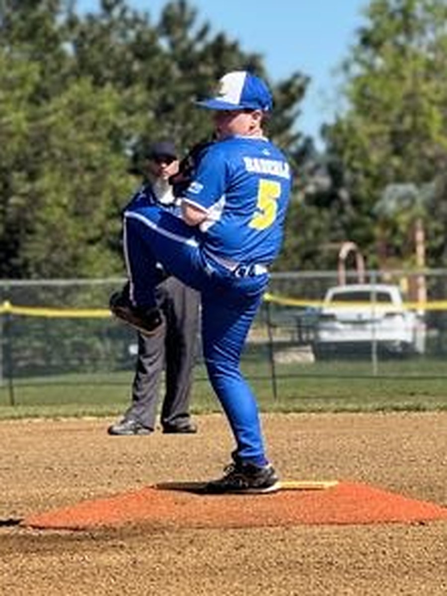 A Canyon Lakers pitcher at the top of his delivery