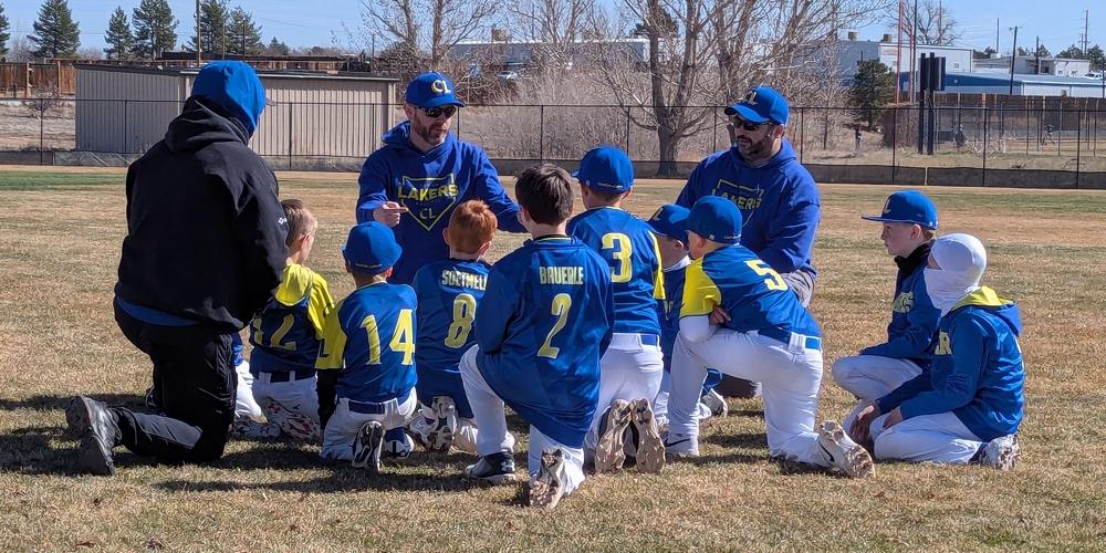 Coach talking to the team on the field