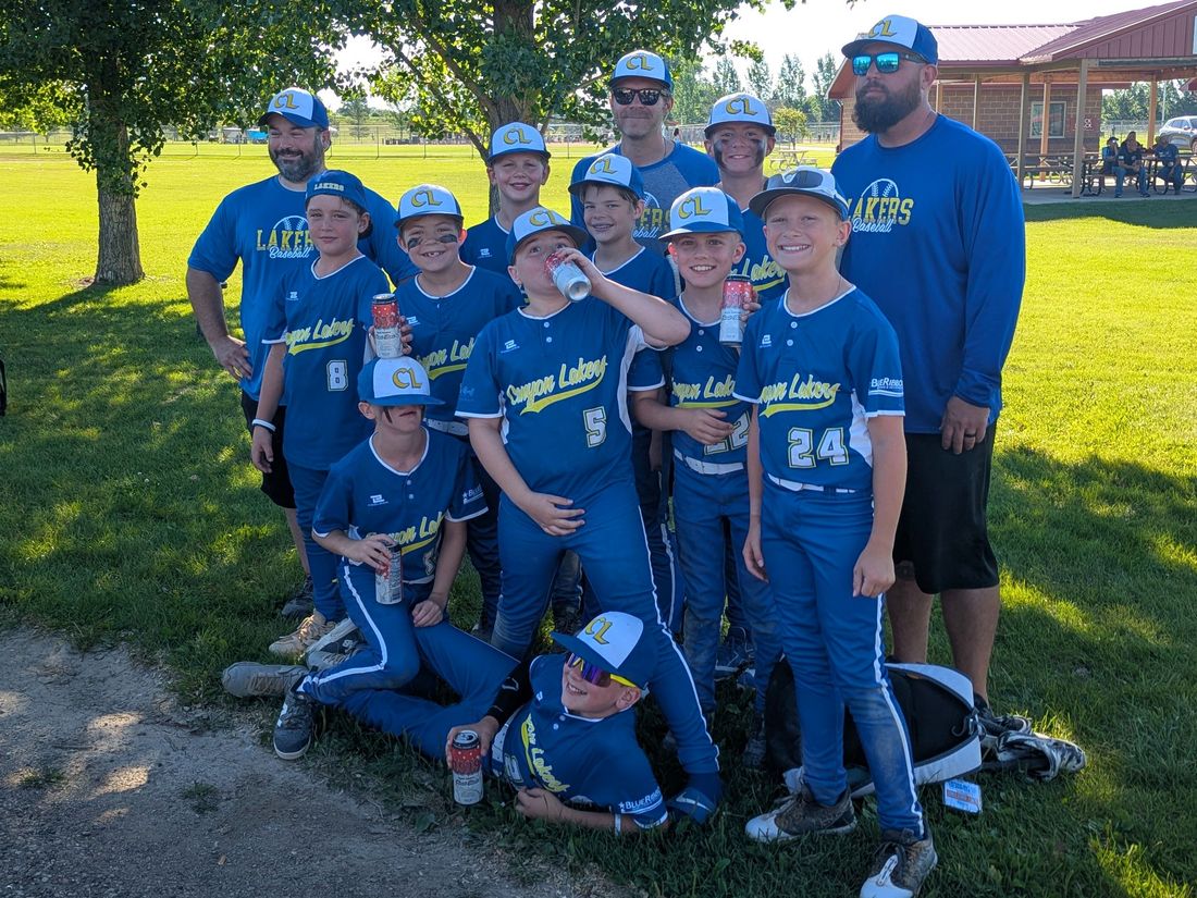 Canyon Lakers team and coaches celebrating after a tournament